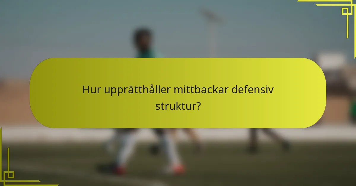 Hur upprätthåller mittbackar defensiv struktur?